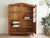 An oak display cabinet, a high-quality replica of historical furniture inspired by 18th-century French designs. The design...