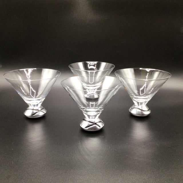 Each glass in this set of 4 features a blown glass bowl on a pewter base with black curled lines. Another stylish cocktail...