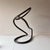 Vintage Arteriors iron loop sculpture when displayed from different angles the piece flows from organic shapes to more...