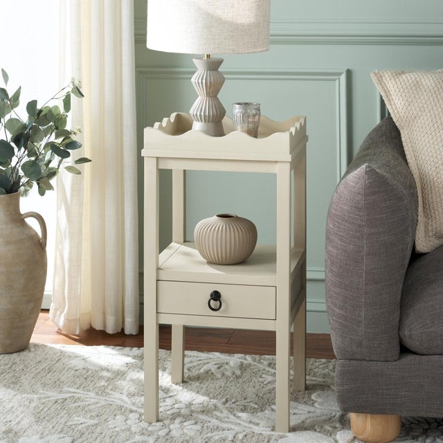 Elevate your space with the Darlyn One Drawer Accent Table in a serene Sand color. This versatile piece features a single...