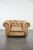 We are offering this unique and large Chesterfield armchair made of cowhide leather in a light cognac color with...