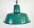 Industrial green enamel pendant light made by KWE in Poland during the 1960s. White enamel inside the shade. Iron top. The...