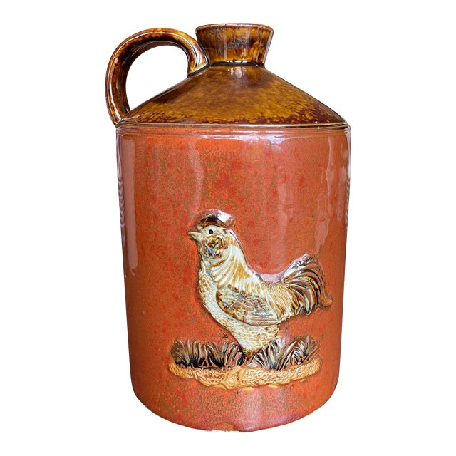 Mid 20th Century Vintage Stoneware Ceramic Two-Toned Gloss Glazed Red & Brown Whiskey Jug Rooster Relief Motif Farmhouse Country For Sale