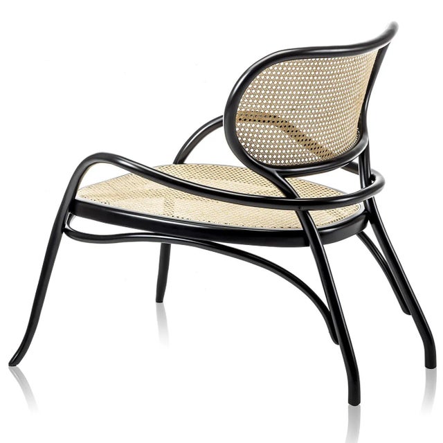Timeless and sophisticated, this lounge chair was designed in 2014 by Nigel Coates. This refined piece combines two...