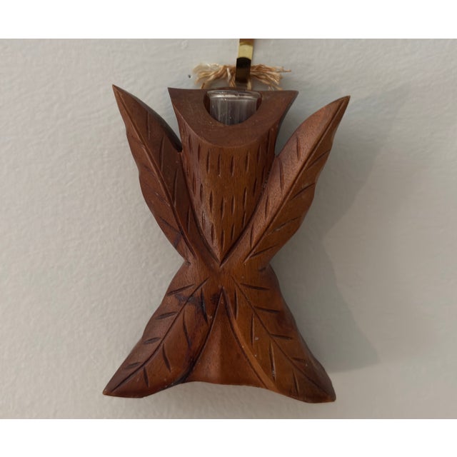 Offered, a vintage hand-carved wooden, possibly south Pacific or African or Hobo art. Features leaves surrounding a glass...