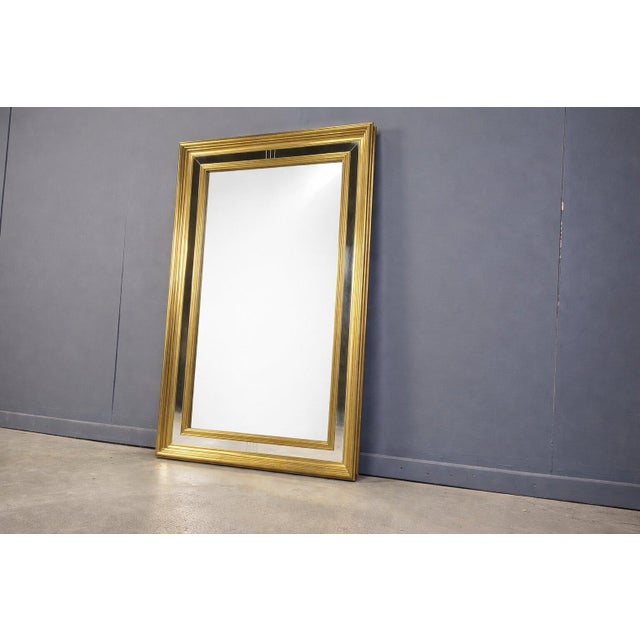 Very large giltwood mirror made in Belgium. Beautiful golden frame with inlaid mirror. Large in size, great statement...