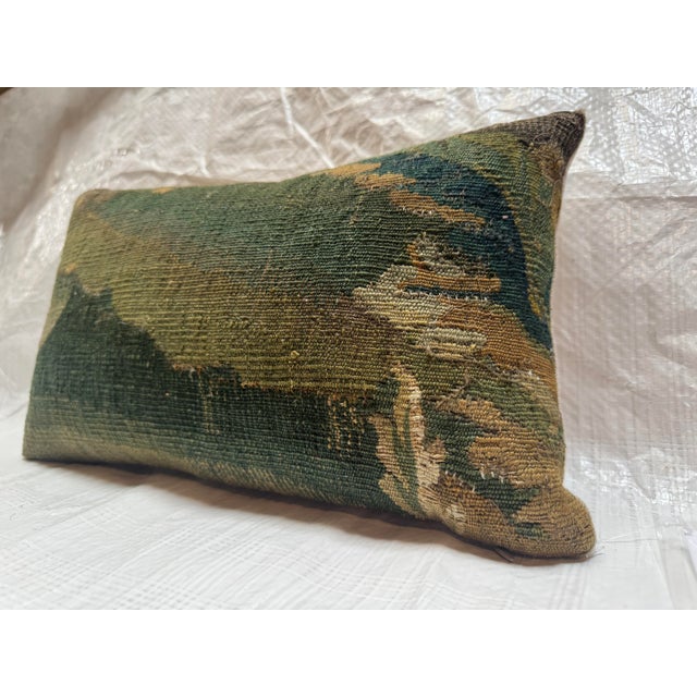 This decorative pillow is created from an authentic 17th century Brussels tapestry fragment, originating from the renowned...
