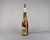 A very large and very eye-catching vintage promotional chalkware table lamp in the shape of a bottle of blue nun, complete...