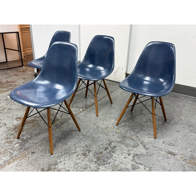 Design Plus Gallery presents a Set of Four Molded Fiberglass Chairs by Charles + Ray Eames for Herman Miller. This iconic...