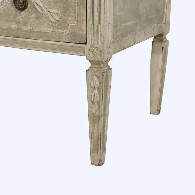 A charming Swedish Gustavian two-drawer chest dating to the late 18th century, distinguished by its elegant neoclassical...