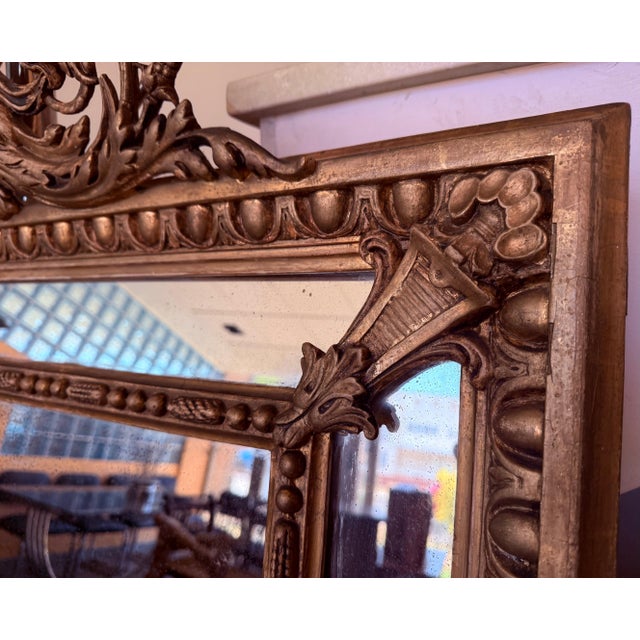 An exceptional large scale mirror hand-crafted in France, this piece is vertical symmetrical and the original mirror plate...