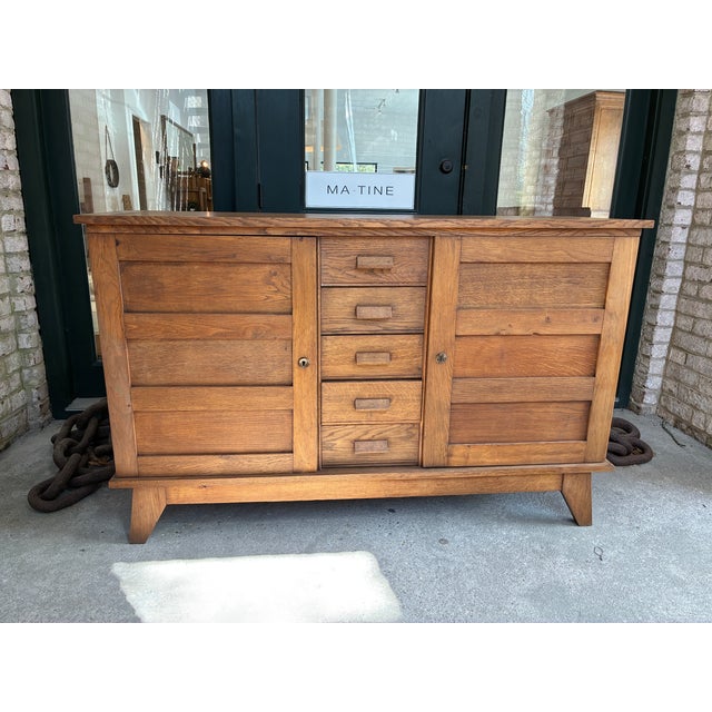 Sideboard by Rene Gabriel, France. This piece features angled mid century lines and the patina to the wood is gorgeous....