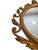 This vintage Syroco mirror is a beautifully detailed decorative piece that embodies the opulence of Hollywood Regency...