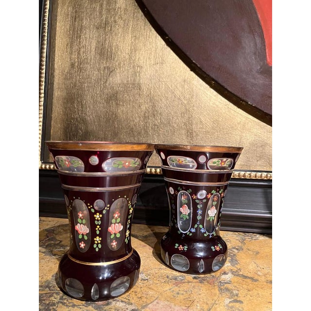 Elegant pair of antique Bohemian goblets dating from the late 19th to early 20th century, executed in richly toned amber-...