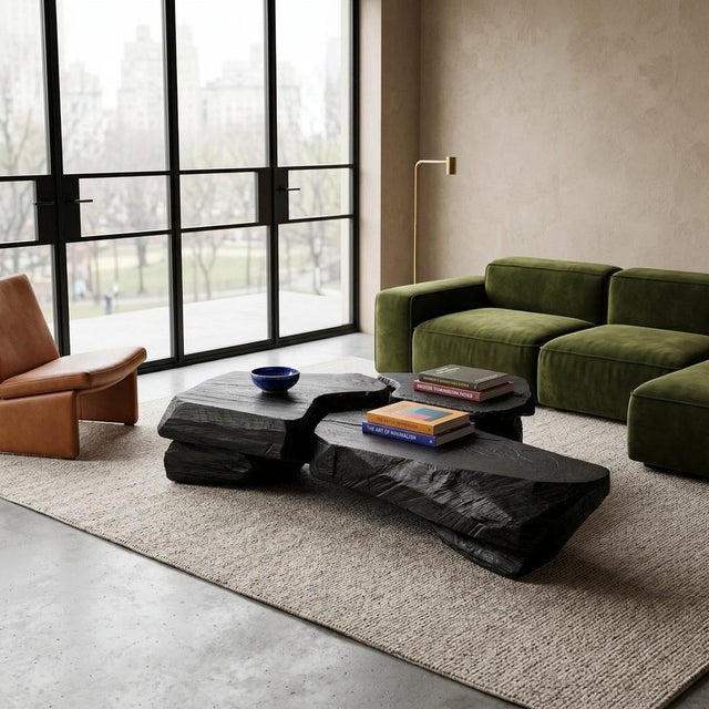 Carved from solid hardwood, this coffee table is one of the most architecturally ambitious pieces in the Logniture...