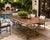 Crafted with exceptional attention to detail, this substantial vintage dining table features a beautifully polished...