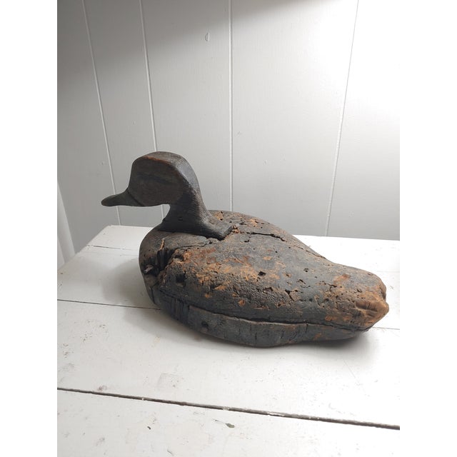 Here a primitive duck decoy that has aged through time and usage. From it's hand painted eyes to it's cork body, it exudes...