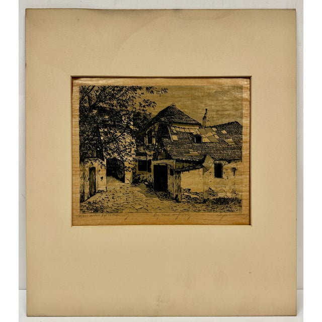 Very unique pencil signed etching depicting a residential component of a European Village. The age is estimated to be...