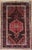Antique hand-knotted rug from the Tuyserkan (Toeiserkan) region of western Iran, featuring a large central hexagonal...