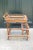 Vintage rattan and wicker bar cart or tea cart. Three levels with glass shelves. Top surface is a removable glass and...