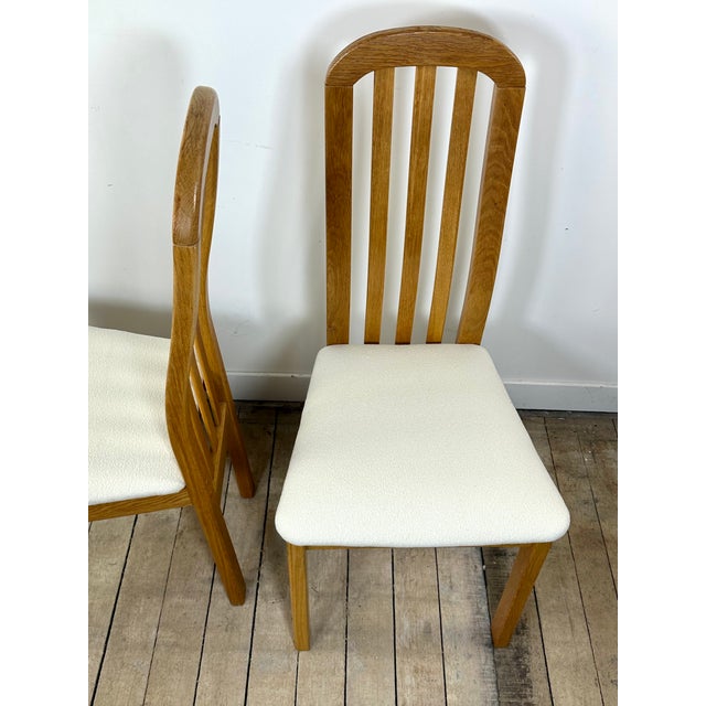 Set of four solid elm chairs upholstered in off-white bouclé fabric. Vintage, stamped Findahls, Denmark, 1980s. Beautiful...