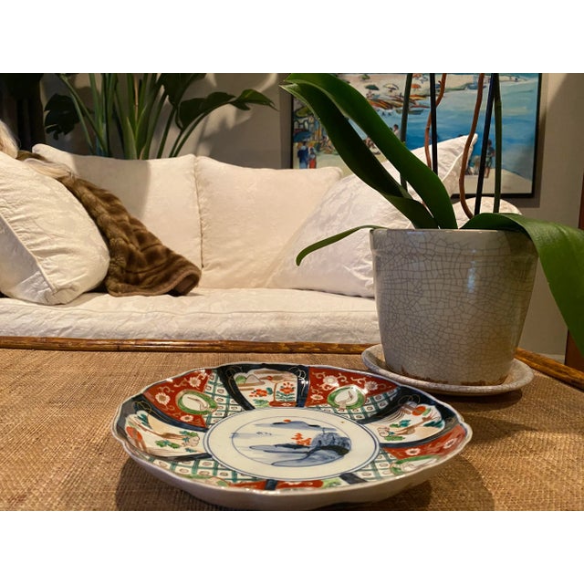 Property from a Prominent East Coast Collection. Hand-painted Japanese porcelain plate with gold embellishment. Decorated...