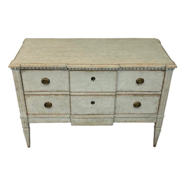 A beautifully matched pair of 19th-century Gustavian-style chests, showcasing the refined elegance and quiet...