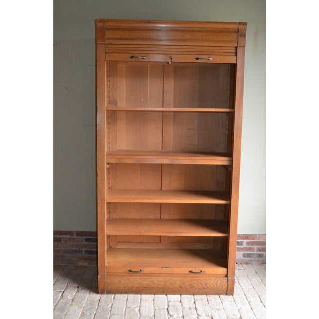 : 20th-century Dutch oak roller shutter cabinet, filing cabinet. The height is 212 cm. The width is 110 cm. The depth is...