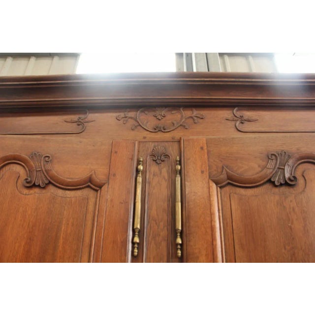 This buffet in two parts is made of oak. It comes from the XVIII period and has eight doors, 4fourdrawers, and brass...