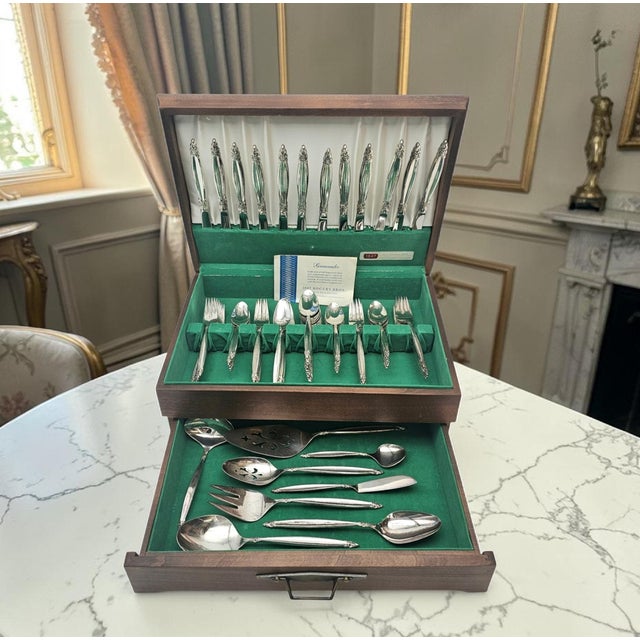 A complete mid-century American silverplate flatware service by 1847 Rogers Bros in the enduring “Garland” pattern,...