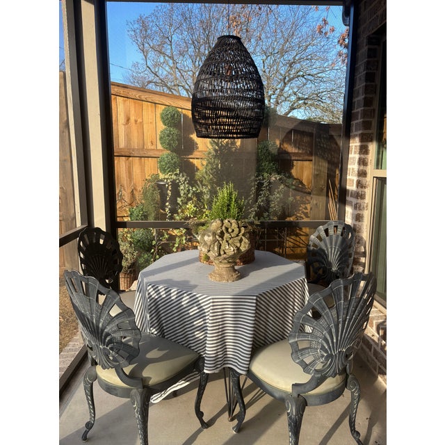 This is a vintage cast-stone garden basket / fruit urn, modeled as a densely piled arrangement of fruit and flowers...