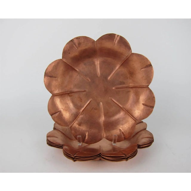 An Arts & Crafts era set of fluted, flower-form shallow bowls / dishes in copper by noted American metalsmith, jeweler,...