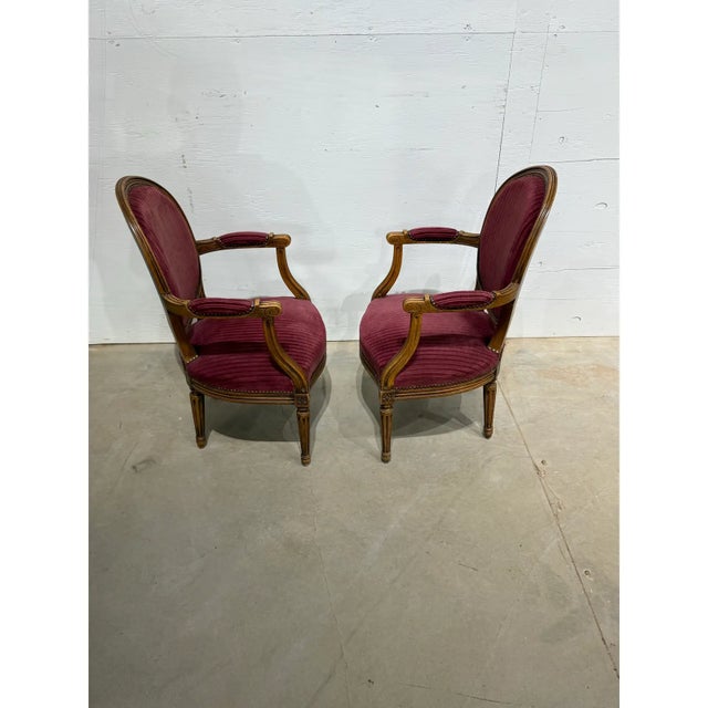 Pair of French Louis XVI Armchairs from south France made of solid walnut, the wood has been finished with a lustrous...