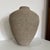 This piece represents a definitive example of 1980s American Postmodern design, turning industrial, disposable packaging...