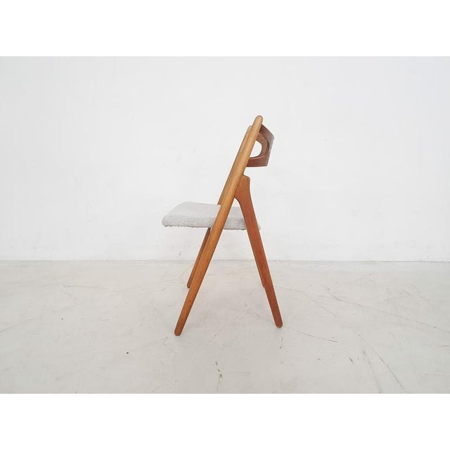 About this item Teak dining chair by Hans Wegner for Carl Hansen and Son. with new off white upholstery. Marked with "80"...