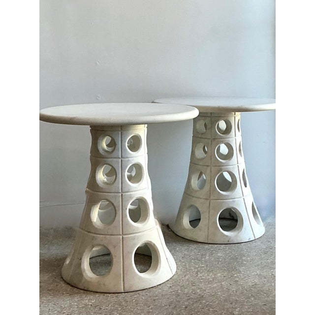 This exceptional pair of vintage Italian side tables showcases a masterfully executed sculptural form, merging robust cast...