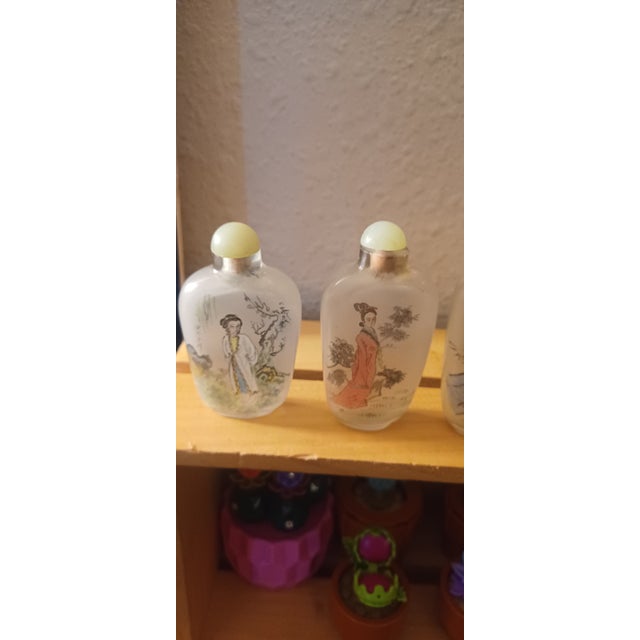 set of 5 hand painted bottles, they are painted on the inside. about 2 to 3 inches tall