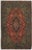 Vintage hand-knotted Persian Qom wool rug on a silk foundation, featuring a red field with a central medallion and dense...