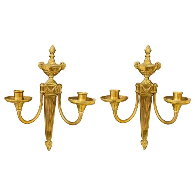 A pair of 1920’s gilt bronze Caldwell sconces with ram’s heads and two lights