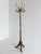 This elegant vintage Italian coat rack from the 1960s combines practical functionality with rich decorative craftsmanship....