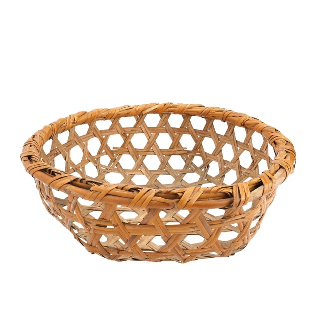 Vintage split bamboo hexagonal weave market basket. The split bamboo is framed by a circular shaped bamboo cane lashed...