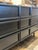 Black dresser with mid-century modern style. Featuring nine drawers in varying sizes, tapered legs, dovetail joinery and a...