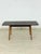 Beautiful, original vintage dining table in a timeless mid-century design. The table impresses with its elegantly shaped,...