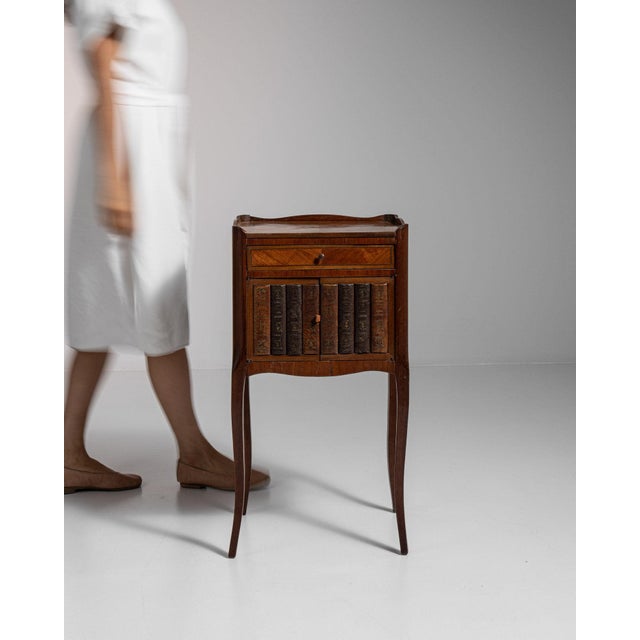 Carved walnut side cabinet in Rich Walnut Brown. The rich walnut brown surface highlights fluted styles, single drawer...