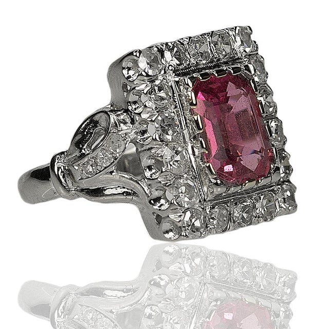 14k White gold ring with AGL certified 2.56 carat Pink Sapphire and 24 round diamonds weighing approximately 0.90 carats....