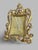 Superb rectangular gilt bronze frame mounted on two cabriole legs with a rear support. The front is richly chased with...