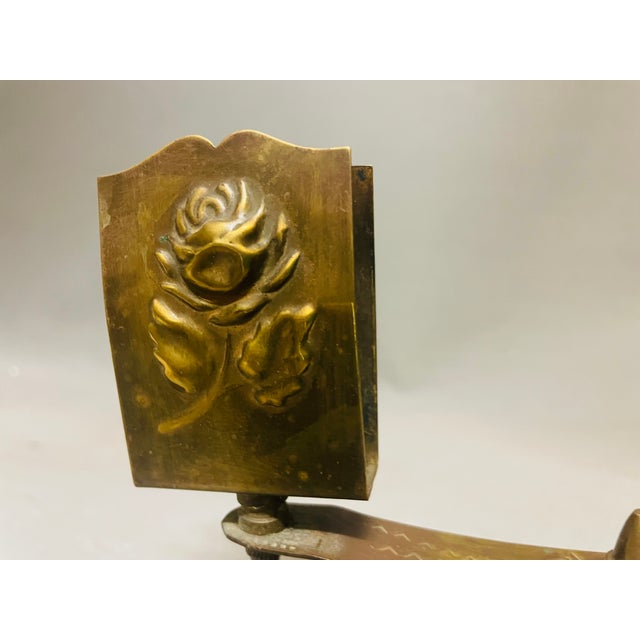 Interesting vintage brass candle holder for tapered candles, equipped with a matchbox holder. They were used in churches....