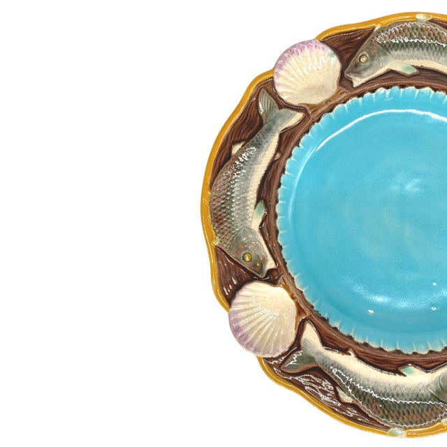Minton Majolica seafood plate with fish and shells, English, dated 1873, the scalloped center glazed in turquoise,...