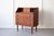 An exquisite and compactly sized teak bureau, produced in Denmark in the 1960s, with three large and two small drawers,...