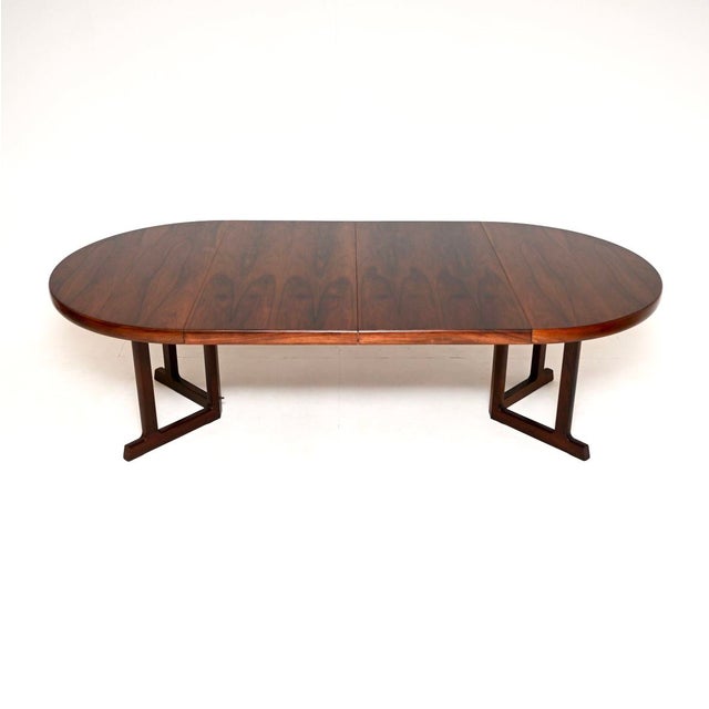 A stunning Danish vintage dining table by Johannes Andersen. It was made in Denmark by Hans Bech, and dates from the...